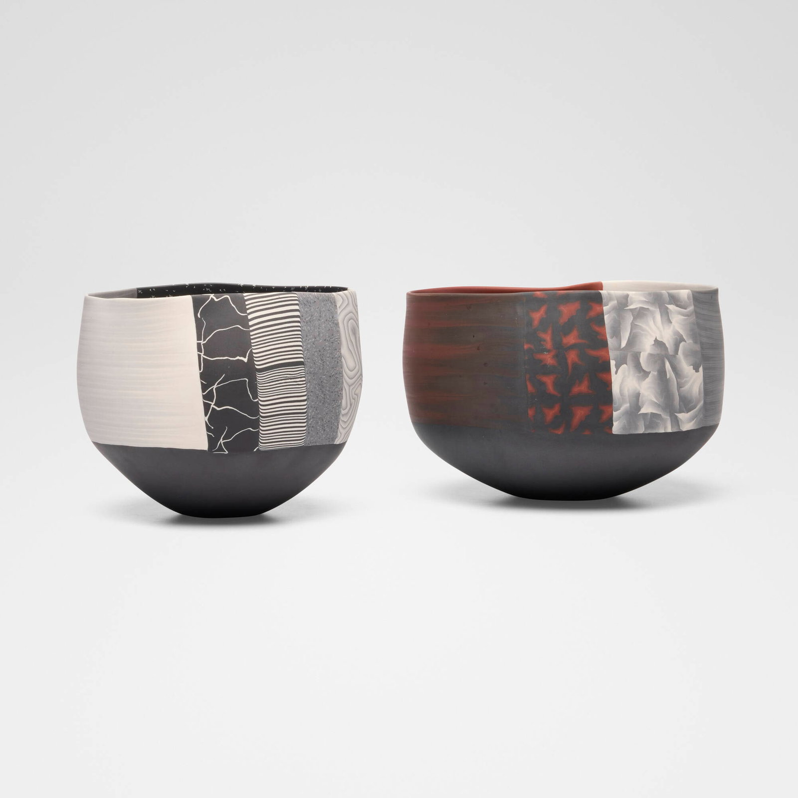 Thomas Hoadley, Nerikomi vases, set of two: Thomas Hoadley Nerikomi vases, set of two colored porcelain 6.25 h x 7.75 w x 7.375 d in (16 x 20 x 19 cm) 6 h x 9 w x 8.75 d in (15 x 23 x 22 cm) Signed to underside of each example 'TH'.