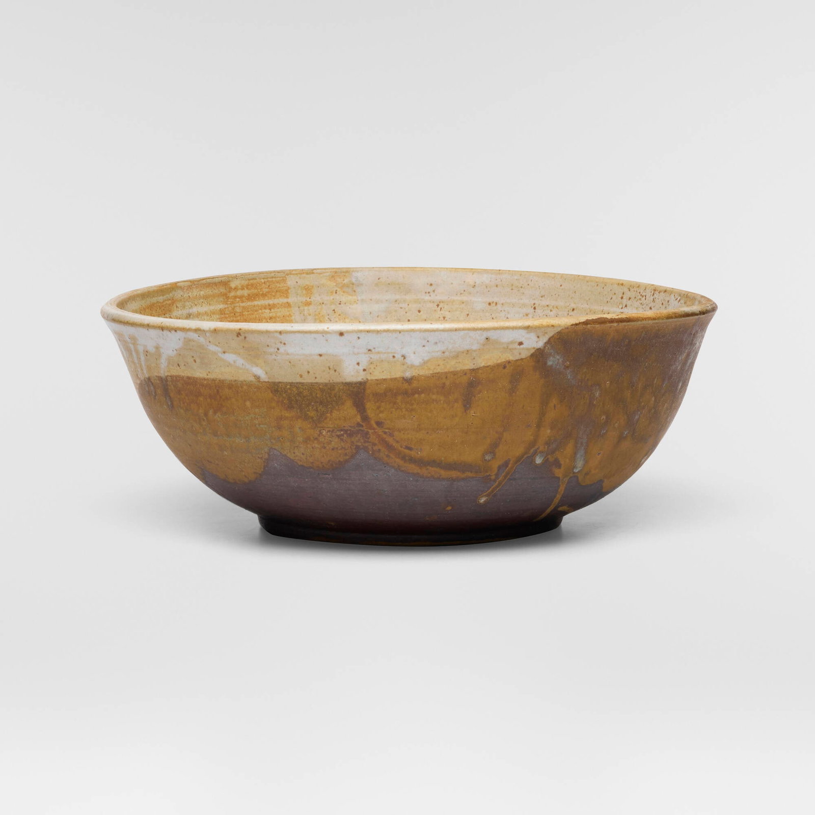 Toshiko Takaezu, Large bowl: Toshiko Takaezu Large bowl c. 1970 glazed stoneware 5.25 h x 13.5 w x 13 d in (13 x 34 x 33 cm) Incised signature to underside 'TT'. This work will ship from Lambertville, New Jersey.