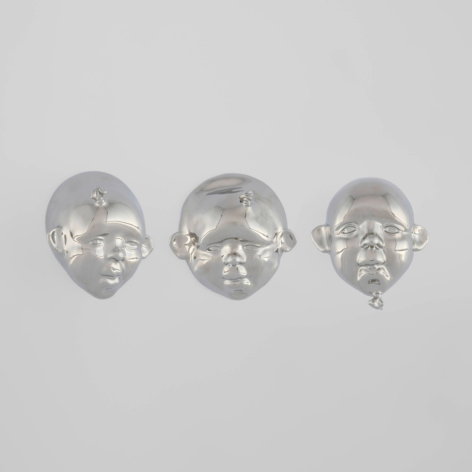 Kyungmin Park, Balloon Heads (three works): Kyungmin Park Balloon Heads (three works) 2017 platinum-plated porcelain 5.5 h x 5.5 w x 2.25 d in (14 x 14 x 6 cm) 5.5 h x 5 w x 5.5 d in (14 x 13 x 14 cm) 5.25 h x 4.75 w x 4 d in (13 x 12 x 10 cm)