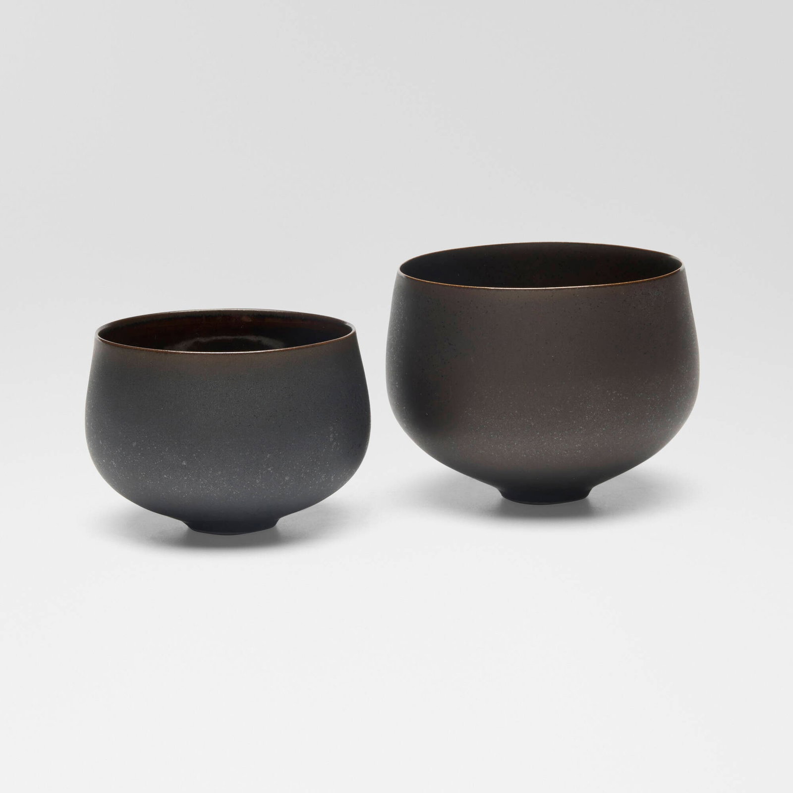 Sara Flynn, Bowls, set of two: Sara Flynn Bowls, set of two c. 2010 glazed porcelain 3 h x 4 dia in (8 x 10 cm) 2.5 h x 3.5 dia in (6 x 9 cm) Impressed chop mark near base of each example 'F'. Provenance: Lacoste/Keane