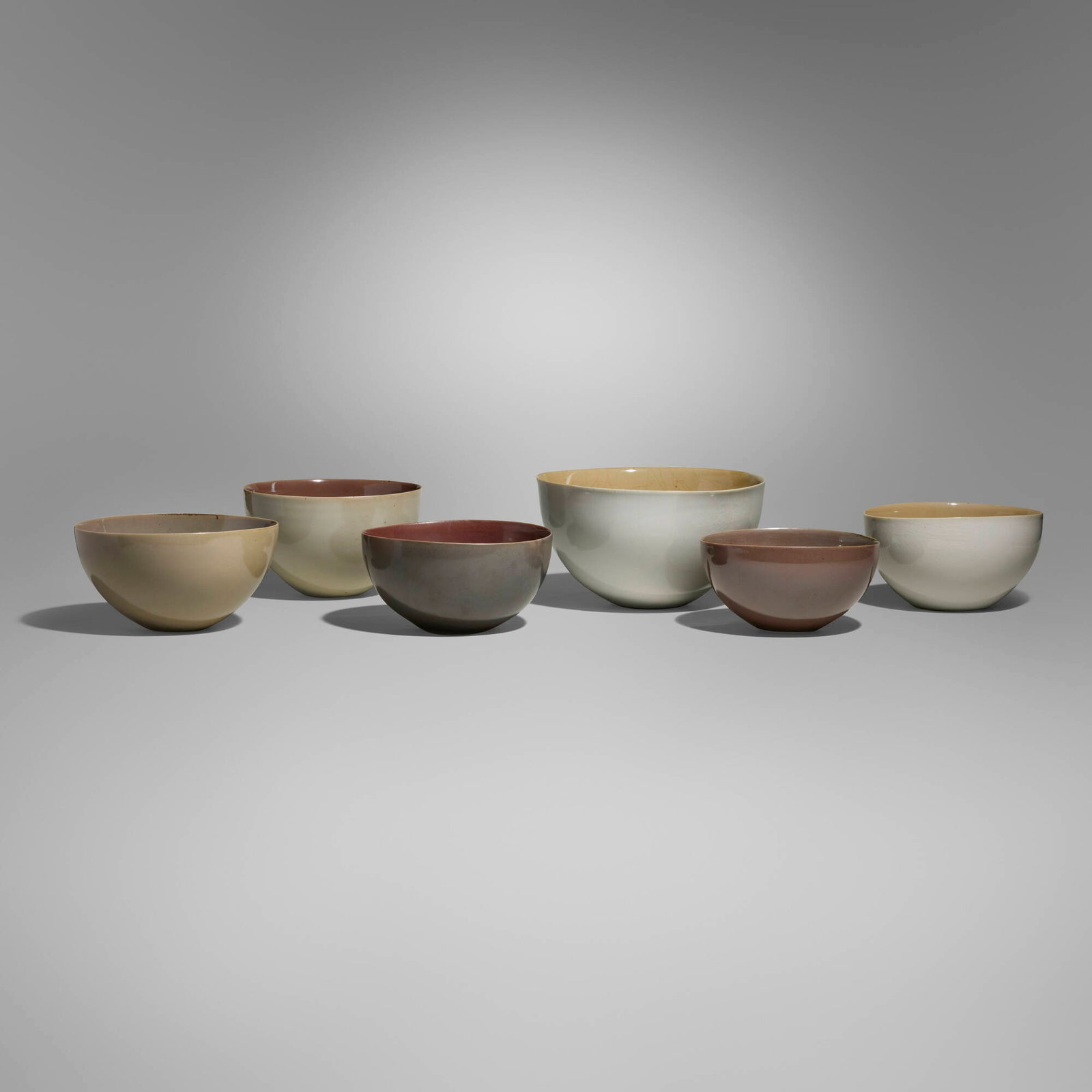 Gwyn Hanssen Pigott, Collection of six bowls: Gwyn Hanssen Pigott Collection of six bowls c. 1991-1995 wood-fired porcelain tallest: 5.5 h x 9.75 w x 10 d in (14 x 25 x 25 cm) shortest: 3.5 h x 7 w x 6.625 d in (9 x 18 x 17 cm) Impressed