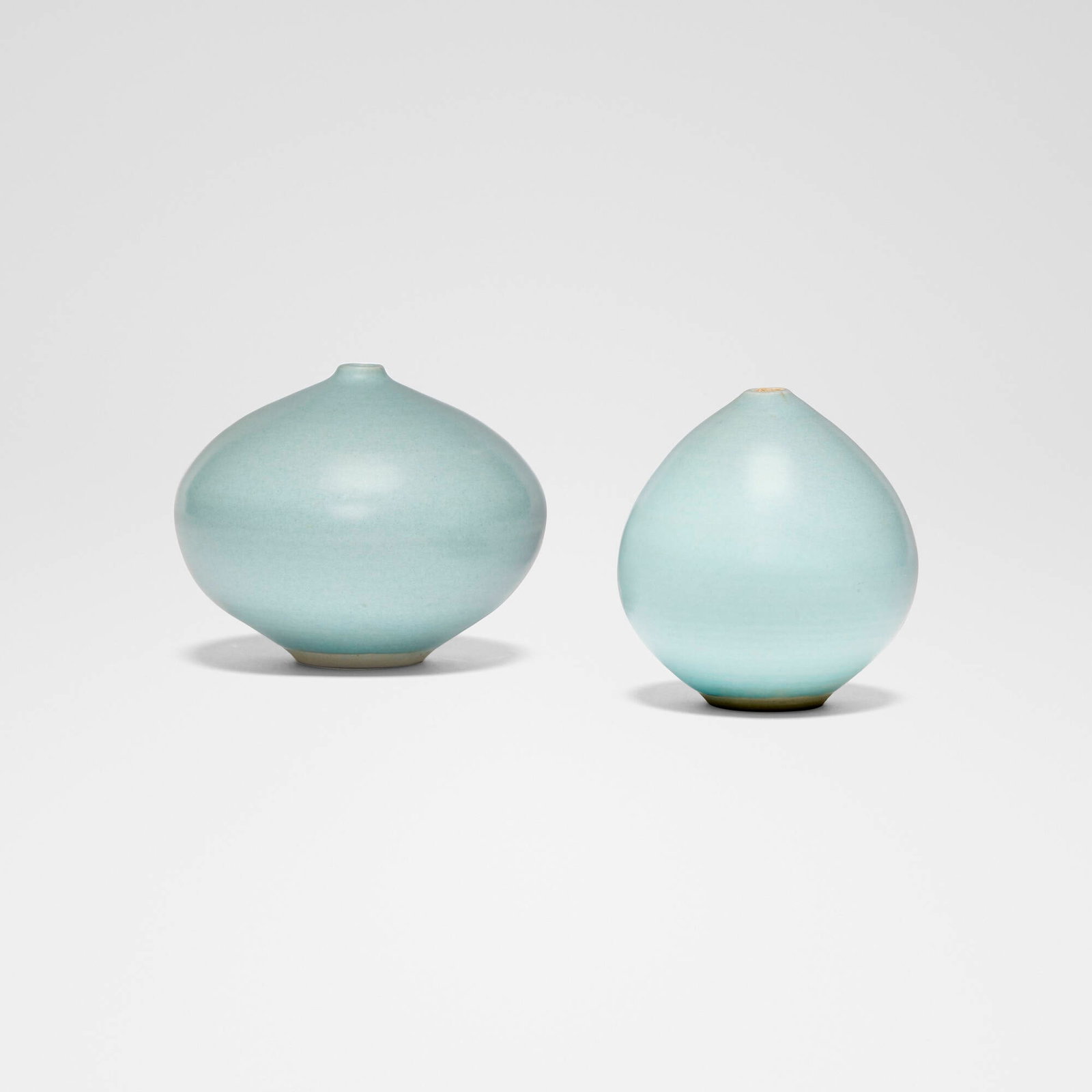 Otto and Vivika Heino, Vases, set of two: Otto and Vivika Heino Vases, set of two glazed porcelain 4.125 h x 4.875 dia in (10 x 12 cm) 4 h x 3.75 dia in (10 x 10 cm) Incised signature to underside of each example 'Vivika + Otto'.