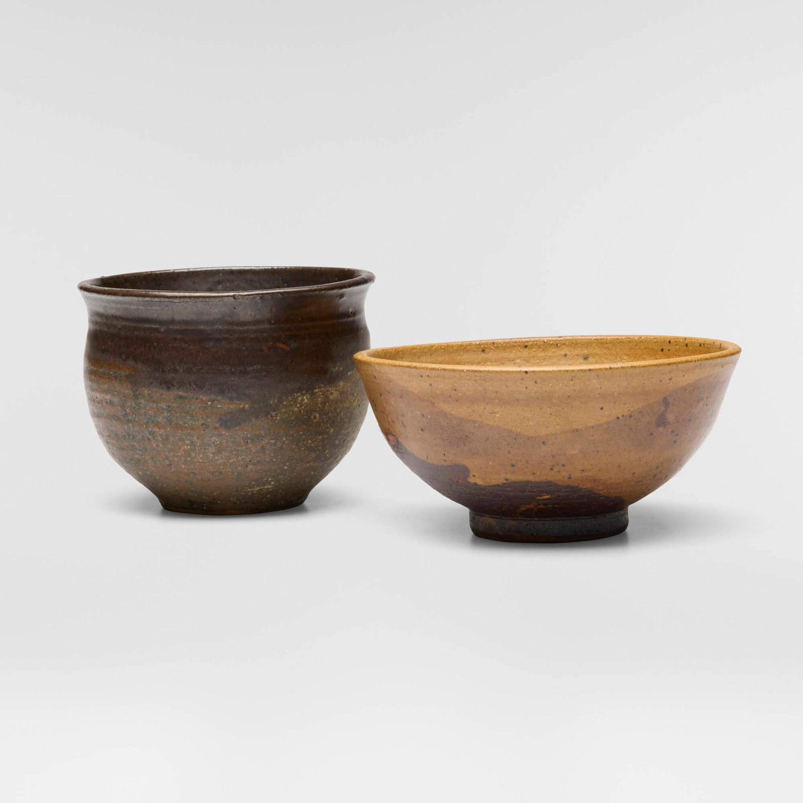 Toshiko Takaezu, Bowls, set of two: Toshiko Takaezu Bowls, set of two c. 1980 glazed stoneware 3.25 h x 6.875 dia in (8 x 17 cm) 4.25 h x 5.25 dia in (11 x 13 cm) Incised signature to each example 'TT'. Provenance: Acquired directly