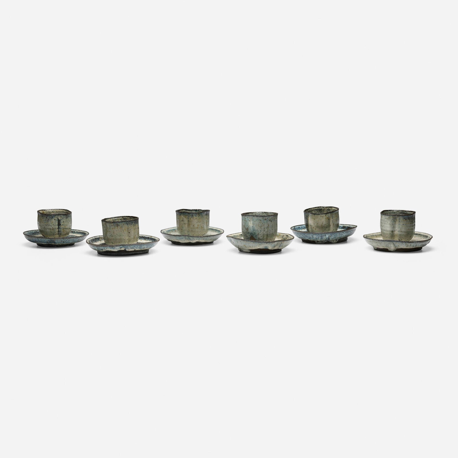Gutte Erikson, Cups and saucers, set of six: Gutte Erikson Cups and saucers, set of six c. 1980 glazed stoneware 3 h x 5.375 dia in (8 x 14 cm) Impressed artist's cipher to underside of example. Provenance: Private Collection, Denmark |