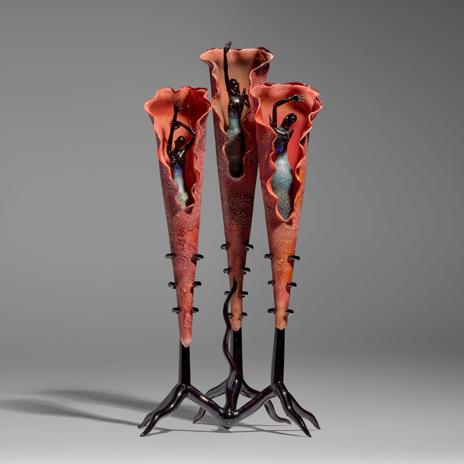 Robert Mickelsen, Triade: Robert Mickelsen Triade 2003 hand-blown and sculpted glass 24 h x 11.5 w x 9.375 d in (61 x 29 x 24 cm) Etched signature and date to base 'R. Mickelsen 2003'. Provenance: Collection of