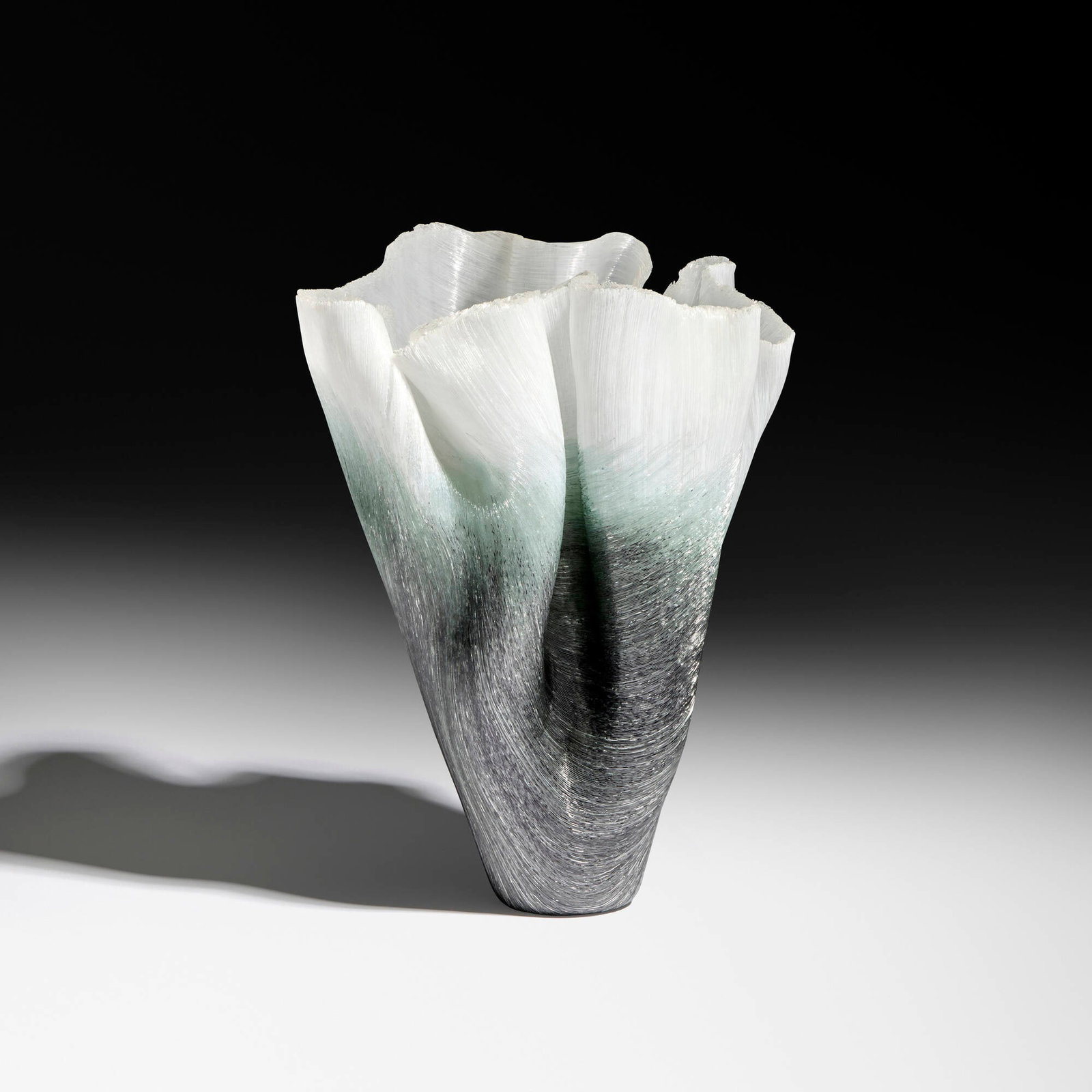 Toots Zynsky, Ghiaccio Ombri: Toots Zynsky Ghiaccio Ombri 2006 filet de verre fused and thermo-formed glass threads 11.125 h x 8.5 w x 7 d in (28 x 22 x 18 cm) The title of this work translates to "ice shadows". Signed to unders