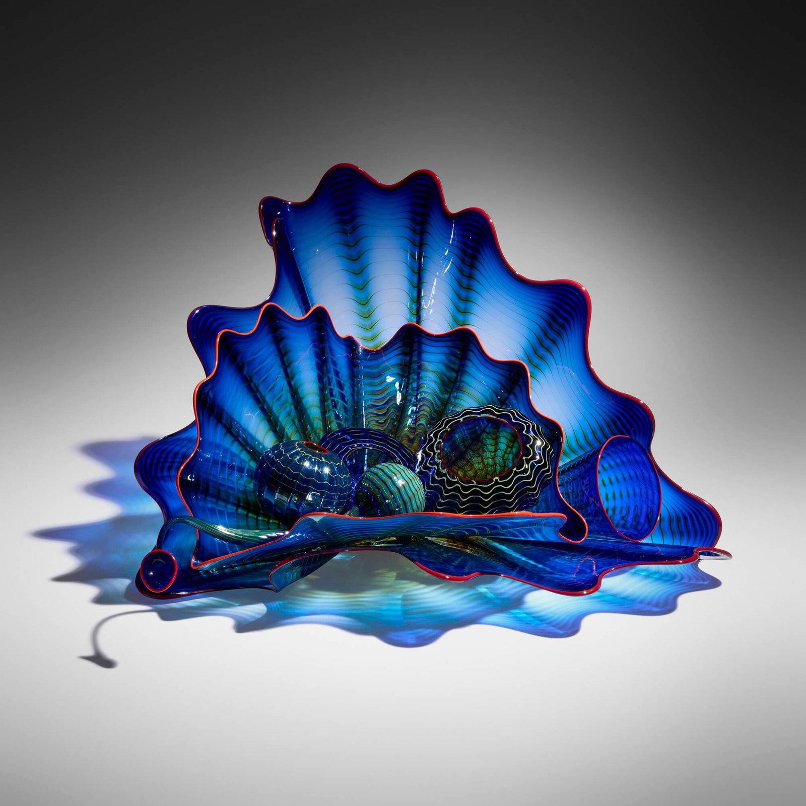 Dale Chihuly, Ultramarine Blue Persian group: Dale Chihuly Ultramarine Blue Persian group 1995 hand-blown glass 13.125 h x 22.25 w x 19.875 d in (33 x 57 x 50 cm) Group is composed of seven elements, originally ten. Sold with a digital copy of