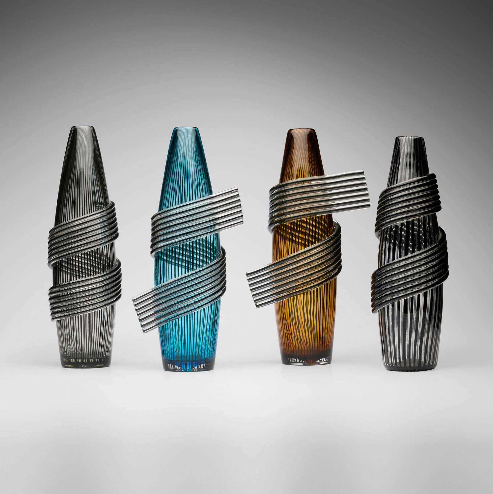 Laura de Santillana, Sciarpe vases, set of four: Laura de Santillana Sciarpe vases, set of four Eos 1990, 1992, 1993 hand-blown and applied glass tallest: 14.375 h x 4.625 dia in (37 x 12 cm) shortest: 13.25 h x 4.625 w x 4.75 d in (34 x 12 x 12 cm)