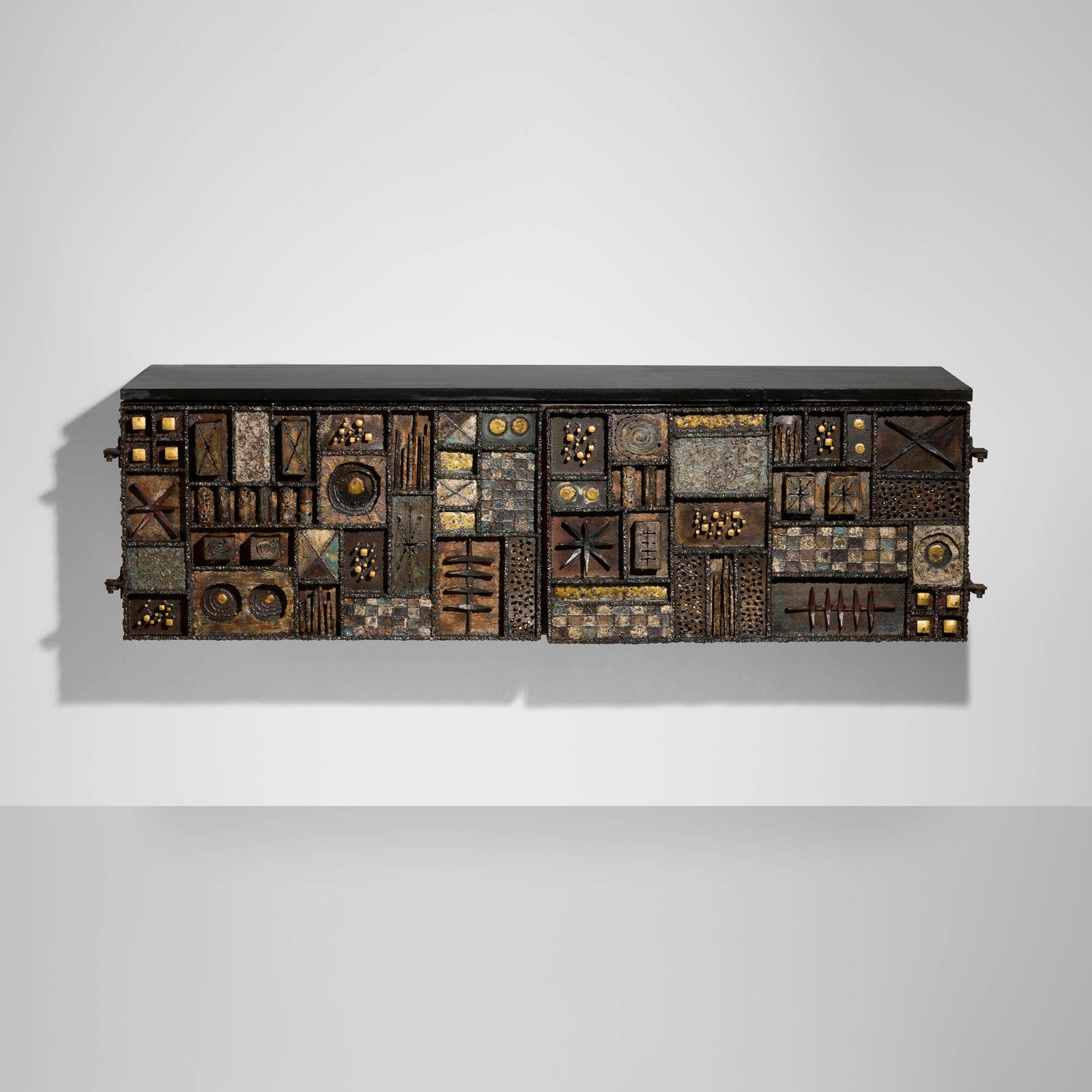 Paul Evans, Sculpture Front wall-hanging cabinet: Paul Evans Sculpture Front wall-hanging cabinet Paul Evans Studio USA, 1964 welded and patinated steel and brass, colored pigments, 23k gold leaf, lacquered wood, slate 21 h x 72.125 w x 21 d in (53