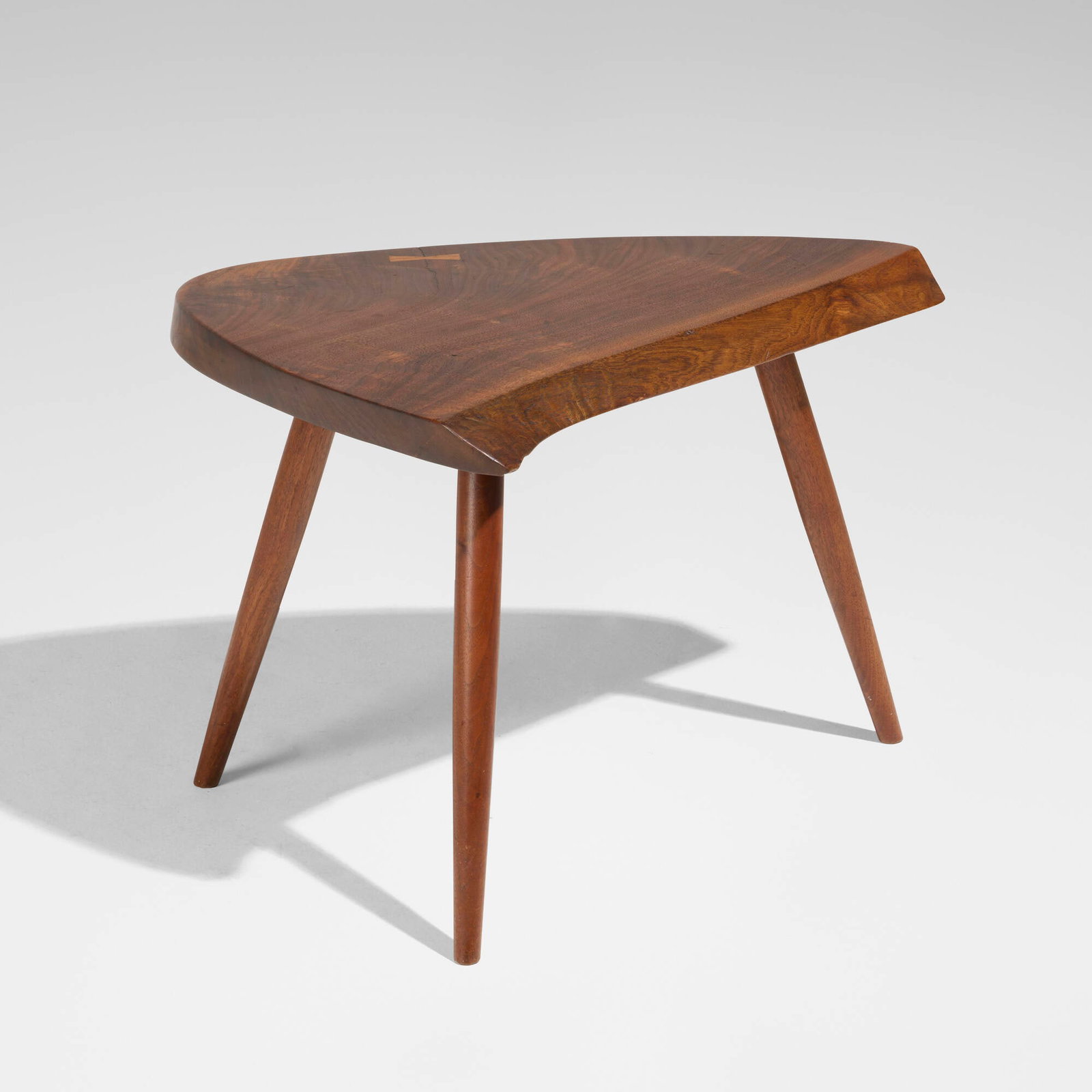 George Nakashima, Wepman occasional table: George Nakashima Wepman occasional table Nakashima Studio USA, 1962 American black walnut, rosewood 17.5 h x 23.75 w x 18.75 d in (44 x 60 x 48 cm) Table features single slab top with one rosewood