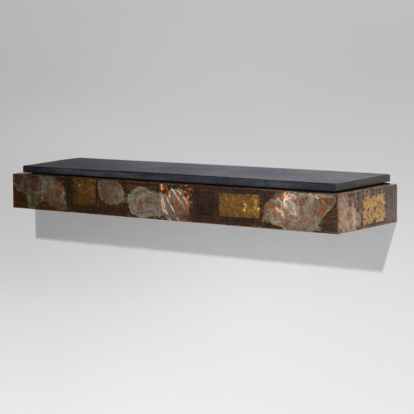 Paul Evans, Patchwork wall-hanging shelf, model PE 17: Paul Evans Patchwork wall-hanging shelf, model PE 17 Paul Evans Studio for Directional USA, c. 1968 welded and patinated pewter, copper, and bronze, slate 6.25 h x 60.125 w x 13 d in (16 x 153 x 33 cm