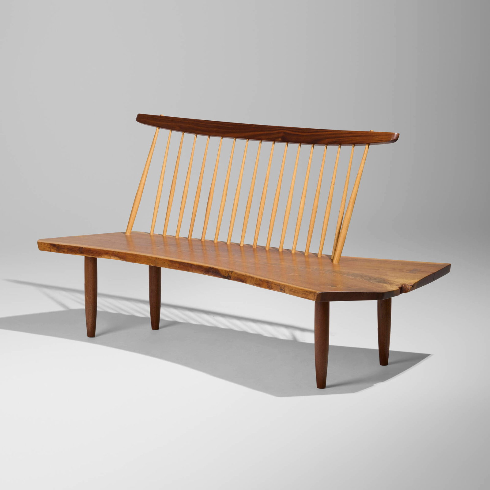 Mira Nakashima, Bench with Back: Mira Nakashima Bench with Back Nakashima Studio 2003 American black walnut, hickory 31.75 h x 65.75 w x 30.75 d in (81 x 167 x 78 cm) Bench features a single slab seat with two free edges and a