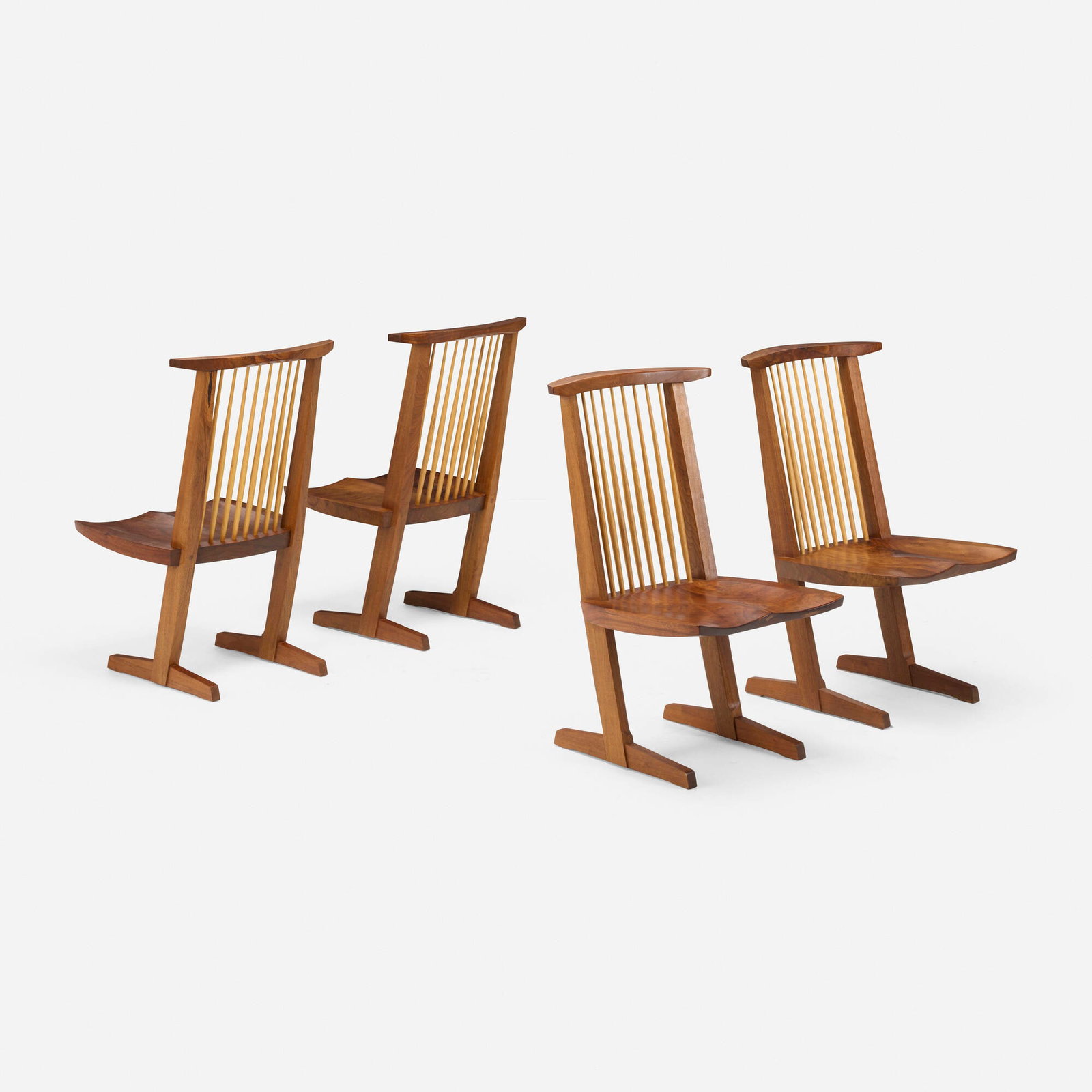 Mira Nakashima, Conoid Host chairs, set of four: Mira Nakashima Conoid Host chairs, set of four Nakashima Studio USA, 2008 / 2010 American black walnut, hickory 38 h x 21.875 w x 23 d in (97 x 56 x 58 cm) Chairs feature figured single slab seats