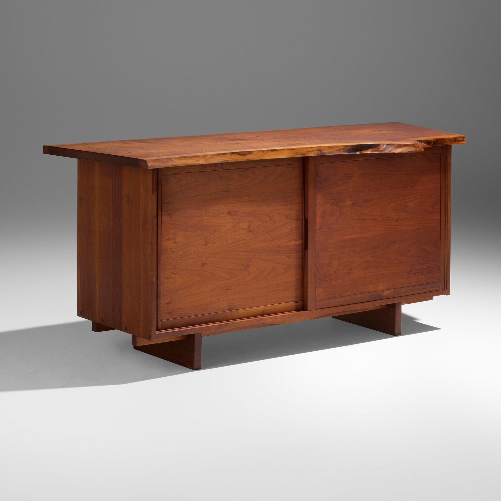 George Nakashima, Exceptional Double Sliding Door cabinet: George Nakashima Exceptional Double Sliding Door cabinet Nakashima Studio USA, 1970 American black walnut, oak 32.25 h x 72.25 w x 26 d in (82 x 184 x 66 cm) Cabinet features a dramatic single slab to