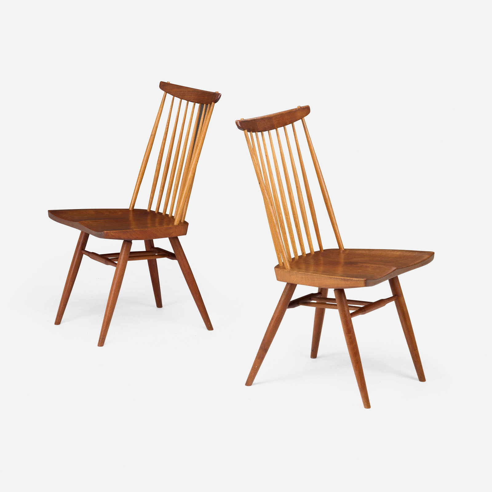 George Nakashima, New chairs, pair: George Nakashima New chairs, pair Nakashima Studio USA, 1957 American black walnut, hickory 35.75 h x 18.75 w x 21.5 d in (91 x 48 x 55 cm) Inscribed with client's name to underside of each