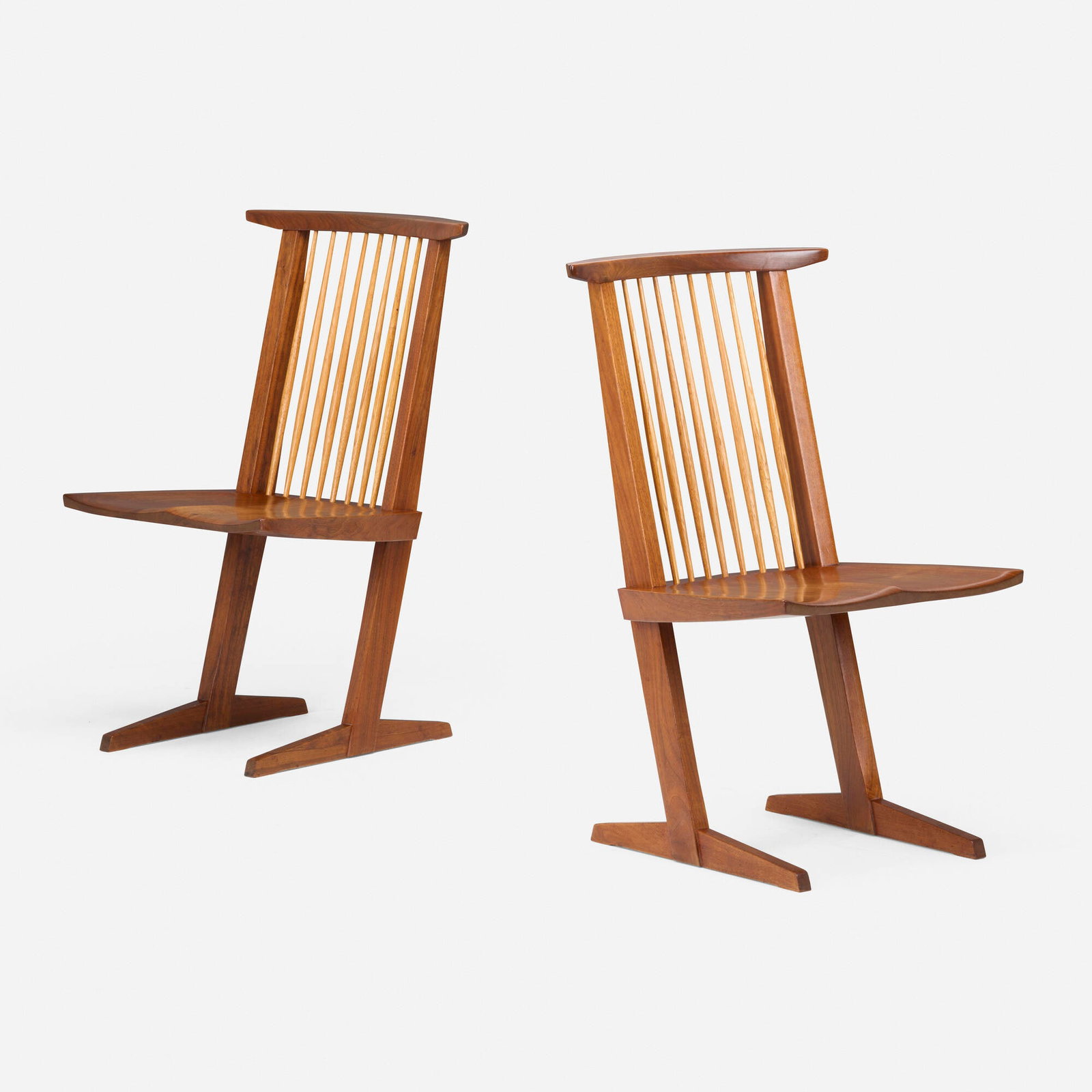 George Nakashima, Conoid chairs, pair: George Nakashima Conoid chairs, pair Nakashima Studio USA, 1965 American black walnut, hickory 35.25 h x 19.875 w x 23 d in (90 x 50 x 58 cm) Dated and inscribed with client's name to underside