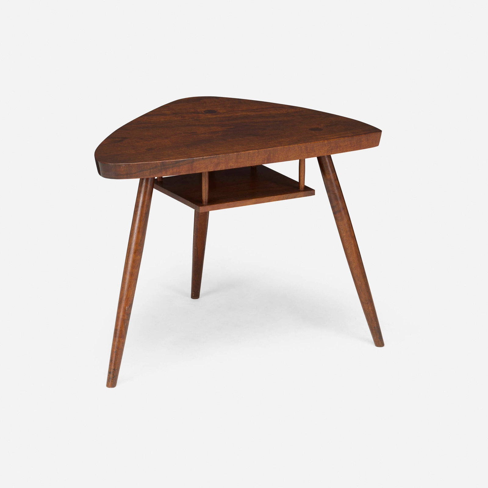 George Nakashima, Rare and Early Wohl occasional table: George Nakashima Rare and Early Wohl occasional table Nakashima Studio USA, 1957 East Indian laurel burl 21 h x 27.5 w x 21.5 d in (53 x 70 x 55 cm) Table features a hanging shelf. Incised