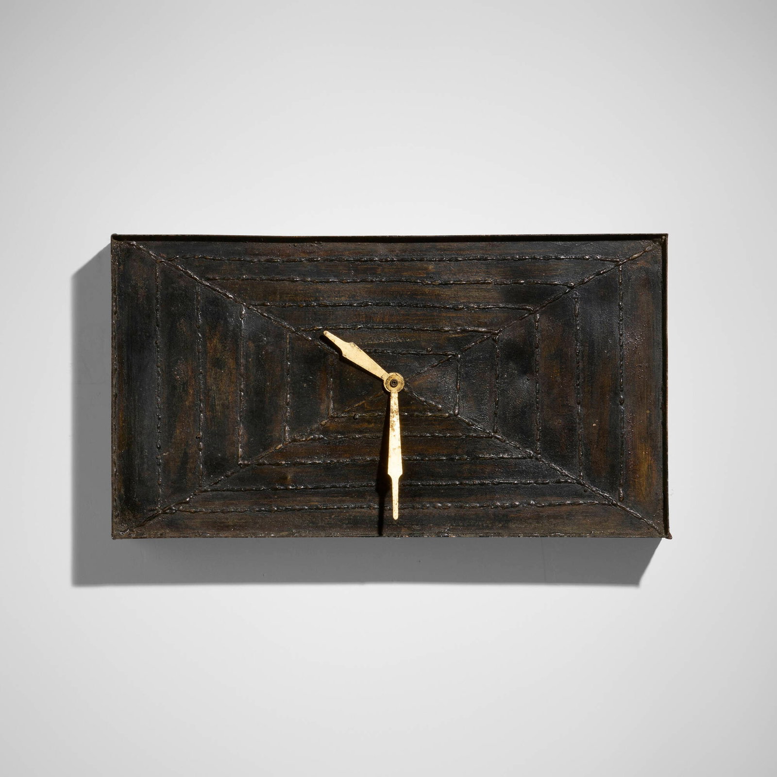 Paul Evans, Rare wall clock: Paul Evans Rare wall clock Paul Evans Studio USA, c. 1965 enameled and welded steel, brass-plated steel 12 h x 22 w x 3.5 d in (30 x 56 x 9 cm) This work is on of only approximately six unique