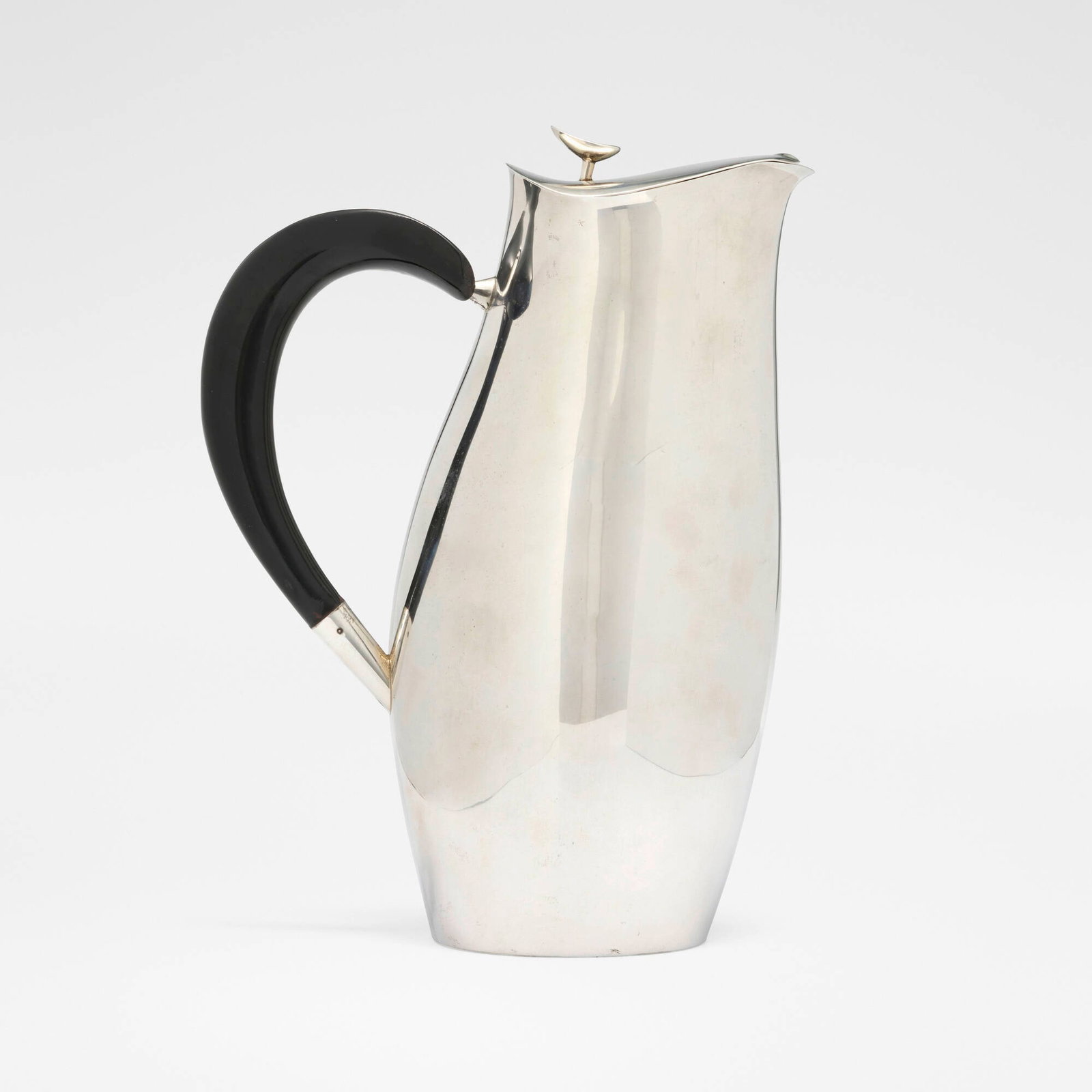 Robert J. King and John Van Koert, Contour coffee pot: Robert J. King and John Van Koert Contour coffee pot Towle Silversmiths USA, c. 1951 sterling silver, melamine 10.125 h x 7.75 w x 4.25 d in (26 x 20 x 11 cm) Impressed manufacturer's mark and to