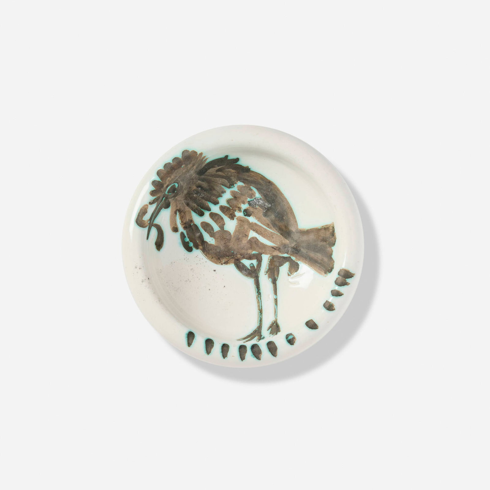 Pablo Picasso, Oiseau au ver ashtray: Pablo Picasso Oiseau au ver ashtray 1952 white earthenware with oxidized paraffin decoration and white enamel 1.875 h x 6.75 dia in (5 x 17 cm) Glazed and impressed studio mark to underside 'Edition P