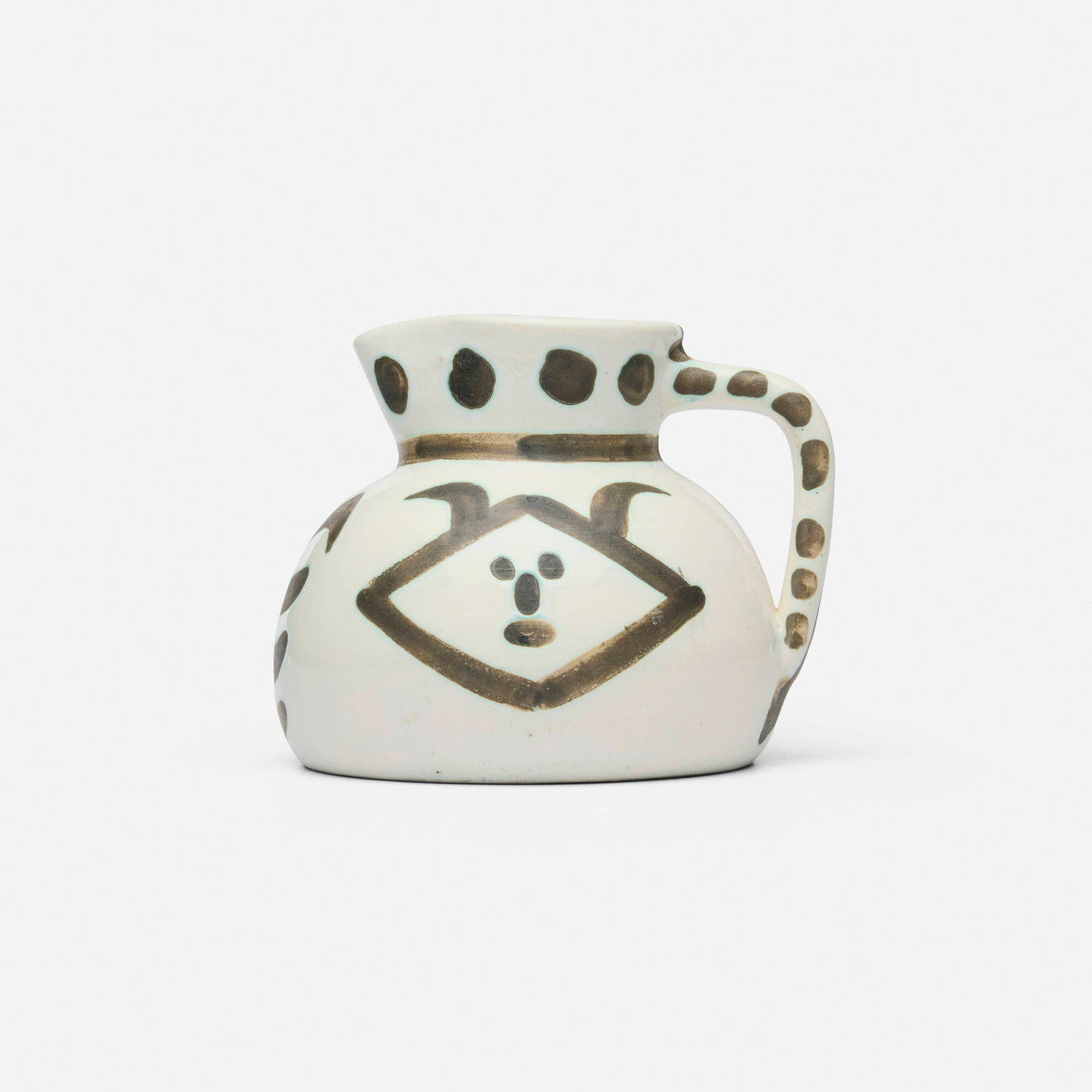 Pablo Picasso, Tetes: Pablo Picasso Tetes 1956 white earthenware with oxidized paraffin decoration and enamel 4.875 h x 6.25 w x 5.625 d in (12 x 16 x 14 cm) Impressed studio mark to underside 'Madoura Plein Feu Edition Pi