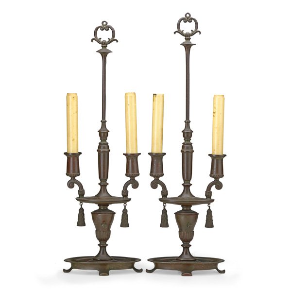 TIFFANY STUDIOS: Pair of bronze candlestick form lamps, early 20th c.; Signed Tiffany Studios NY 673; 22 1/2" x 7" x 4 1/2"