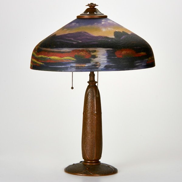 PITTSBURGH: Table lamp, ca. 1910; Reverse-painted shade with bronze base; Paper label to shade; 22" x 15" dia.