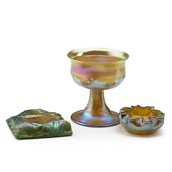 TIFFANY STUDIOS: Three Favrile glass pieces: sherbet cup, salt, turtleback tile, New York, ca. 1905; Sherbet marked L.C.T. W216, salt marked L.C.T., glass tile unmarked; Sherbet: 3 3/4" x 3 1/4"
