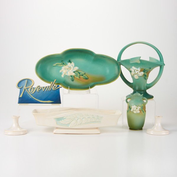ROSEVILLE: Gardenia basket (609-10), vase (681-6), and low bowl (631-14); Silhouette planter (731-14) and candlesticks(751-3); Dealer sign; Zanesville, OH, 1940s; Glazed earthenware; Die-impressed marks to six; 