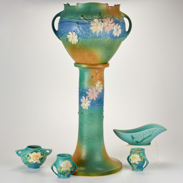 ROSEVILLE: Cosmos jardinière and pedestal (649-10), three Water Lily vases (437, 71-4) and Silhouette console bowl (728-10), Zanesville, OH, late 1930s/40s; Glazed earthenware; Tallest: 32 1/4"