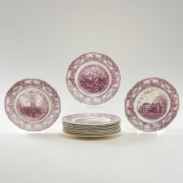 CROWN DUCAL TRANSFERWARE: Twelve "Colonial Times" dinner plates with scalloped rims, England, 20th c.; Decorated with scenes of early American history; Mulberry ink; Marked; Largest: 10 1/2" dia.