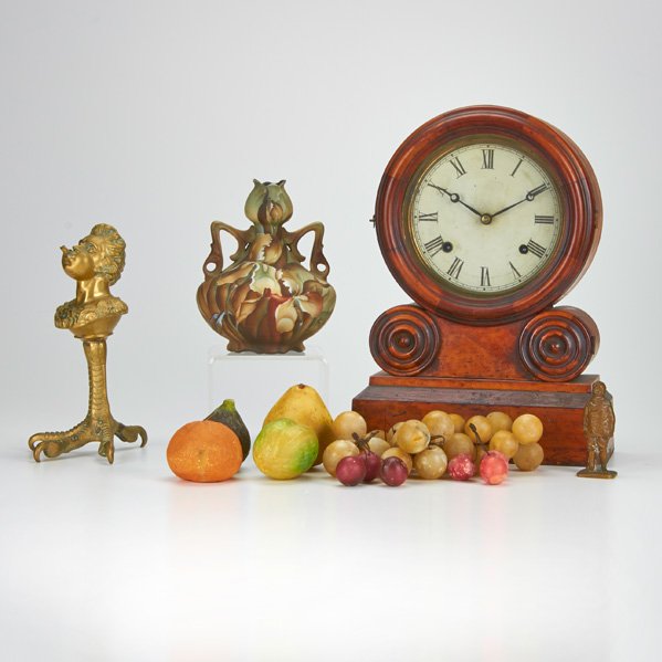 DECORATIVE GROUP: Fourteen pieces, 19th / 20th c.: Elias Ingraham mantel clock cabinet bronze aviator figure, brass lighter with bust, ten pieces of marble fruit and Royal Kinran vase ; Some marked; Tallest: 14 1/2"