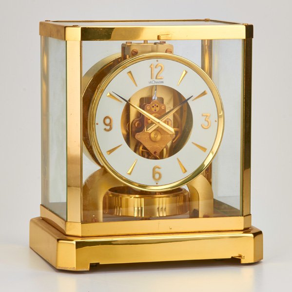 LE COULTRE: Atmos gilt brass table clock, Switzerland, late-20th c.; 9 1/4" x 7 1/2"