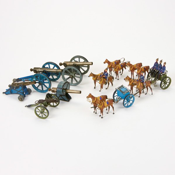 HEYDE (Attr.): Fifteen pieces of toy artillery, Germany, mid-20th c.; Painted lead; Includes four cannons, five pairs of harnessed horses (two with riders), two wagons, and four passengers; Unmarked; Largest: 2 1/4"