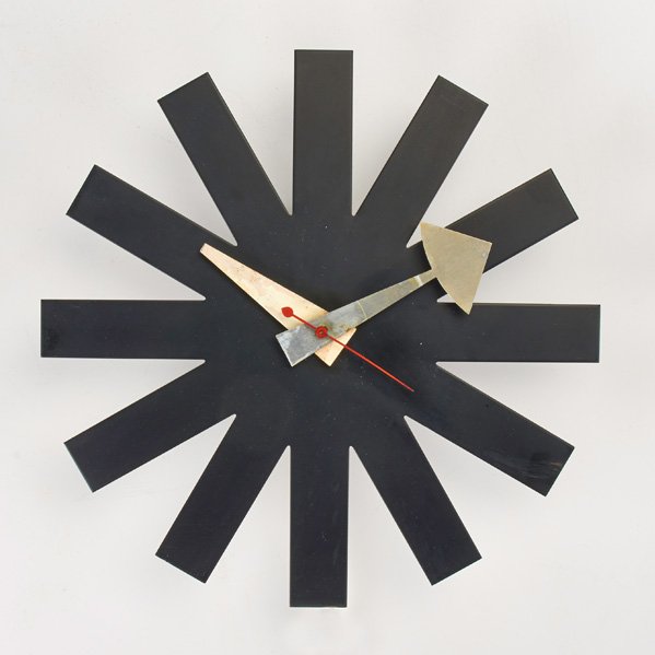 GEORGE NELSON; HOWARD MILLER: Asterisk wall clock, Zeeland, MI, 1950s; Enameled metal, wood; Sticker label; 10" x 10" x 2 1/2"