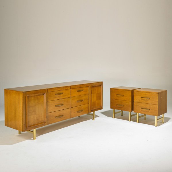 STYLE OF PAUL McCOBB: Dresser and two nightstands, USA, 1960s; Walnut, brass-plated metal; Unmarked; Dresser: 30 1/2" x 78" x 21"; Nightstands: 25 1/2" x 20" x 16"