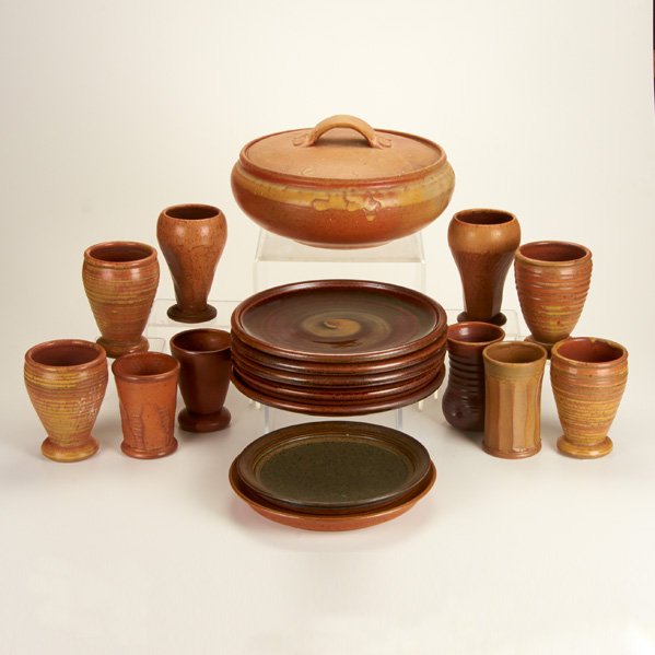 VAL CUSHING: Eighteen pieces of stoneware, USA, 1984-86: seven plates, six beakers, four cups, one covered casserole dish; All marked, many dated; Largest: 13" dia.