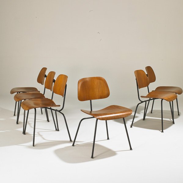 CHARLES AND RAY EAMES; HERMAN MILLER: Set of six dining chairs (DCM), USA, 1950s; Walnut, enameled steel, rubber; Foil labels; 29 1/2" x 19 1/2" x 21"