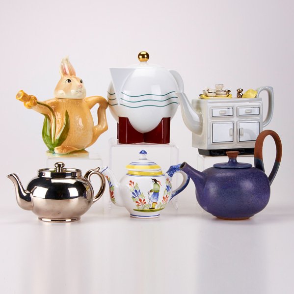 MICHAEL GRAVES FOR SWID POWELL, ETC.: Six teapots, late-20th c.; Includes "The Big Dripper" teapot by Michael Graves for Swid Powell (1985), hand-painted faience teapot by HB Henriot Quimper, porcelain "Kitchen Sink" teapot by South-West