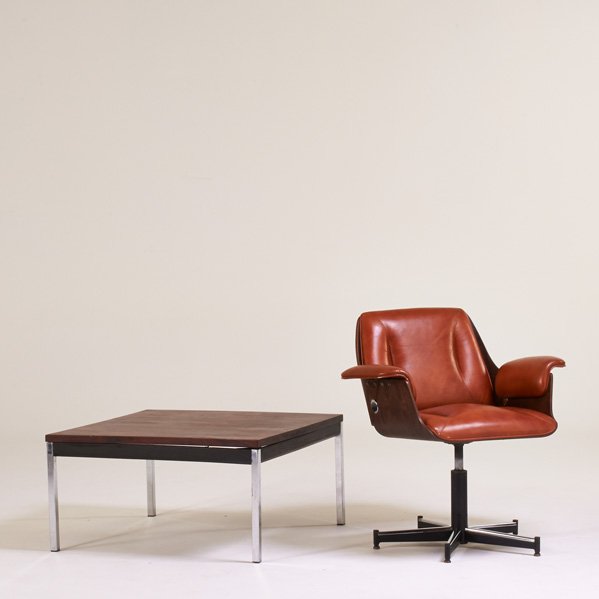 BRAZILIAN MODERN: Armchair and coffee table, 1960s; Rosewood, chromed and enameled steel; Armchair manufacturer label; Chair: 32" x 31" x 27", coffee table: 16" x 32" sq.