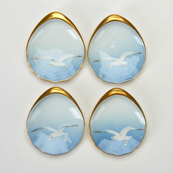 BING & GRONDAHL: Four Seagull oyster plates, Denmark, 1940s / 1950s; Gilded porcelain; Designed by Fanny Garde; All marked "B&G Kjobenhavn / Made in Denmark / 200"; All: 1/2" x 3" x 3 1/2"