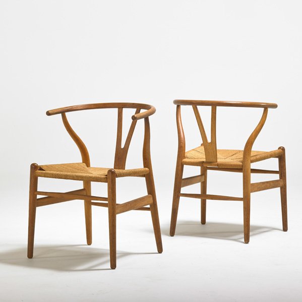 HANS WEGNER; CARL HANSEN: Pair of wishbone chairs, Denmark, 1960s; Oak and woven paper cord; Branded; Each: 28 1/2" x 21" x 19"