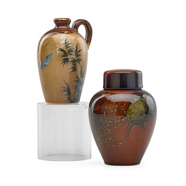 ROOKWOOD Two early vessels: ALBERT VALENTIEN (1862 - 1925) MATTHEW DALY (1860 - 1937) ROOKWOOD Two small glazed ceramic vessels: Limoges-style pitcher by Albert Valentien (1882) and lidded vase decorated with turtles by Matthew 