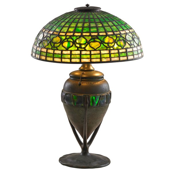 TIFFANY STUDIOS Turtleback lamp base, Acorn shade: TIFFANY STUDIOS Fine table lamp with Acorn shade, its lighting base inlaid with Turtleback glass, New York, 1900s; Bronze, glass, three sockets; Base with circular stamp and TIFFANY STUDIOS NEW YORK 6