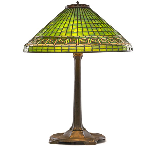 TIFFANY STUDIOS Table lamp, Greek Key shade: TIFFANY STUDIOS Tall table lamp with Greek Key shade, New York, 1900s; Leaded glass, patinated bronze, four sockets; Shade stamped TIFFANY STUDIOS NEW YORK 1916, base stamped TIFFANY STUDIOS NEW YORK 