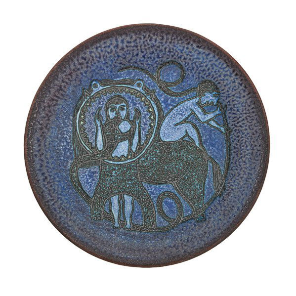 SCHEIER Charger with woman and animals: EDWIN SCHEIER (1910 - 2008) MARY SCHEIER (1908 - 2007) Charger with woman and animals, purple glaze, Green Valley, AZ, 1996; Signed and dated; 16 1/2" dia. Provenance: Collection of Burt Cureton and C