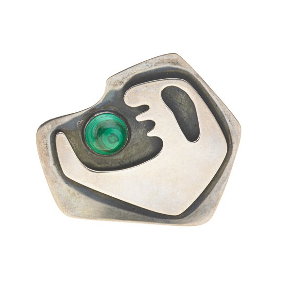 ED WIENER Brooch: ED WIENER (1918 - 1991) Sculptural brooch, New York, ca. 1949; Sterling silver, malachite; Stamped ED WIENER STERLING; 2 1/4" x 2 1/2" Literature: Eidelberg, ed., Messengers of Modernism (1996), p. 14