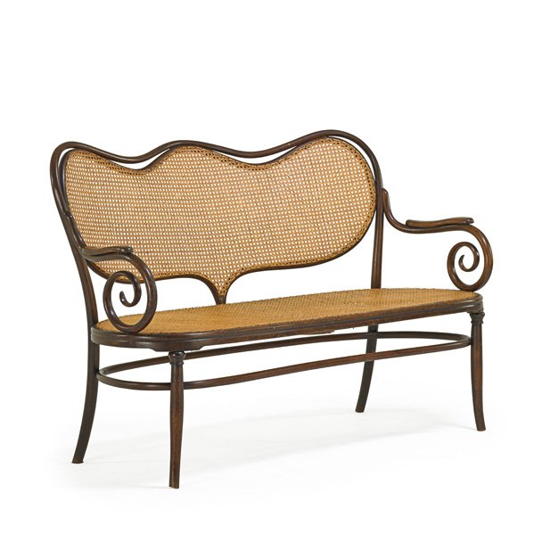 STYLE OF THONET Bentwood bench: STYLE OF THONET Bentwood bench, Austria, ca. 1910; Beechwood, cane; 36 1/2" x 57" x 26"