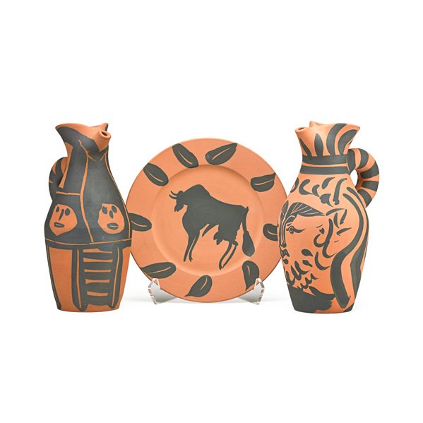 PABLO PICASSO; MADOURA Two pitchers and plate: PABLO PICASSO (1881 - 1973) MADOURA Three earthenware pieces with engobe decoration, France: plate, "Bull, Rim with Leaves (Taureaux, Marli aux Feuilles)," ca. 1957, pitcher, "Bearded Yan (Yan Barbu),