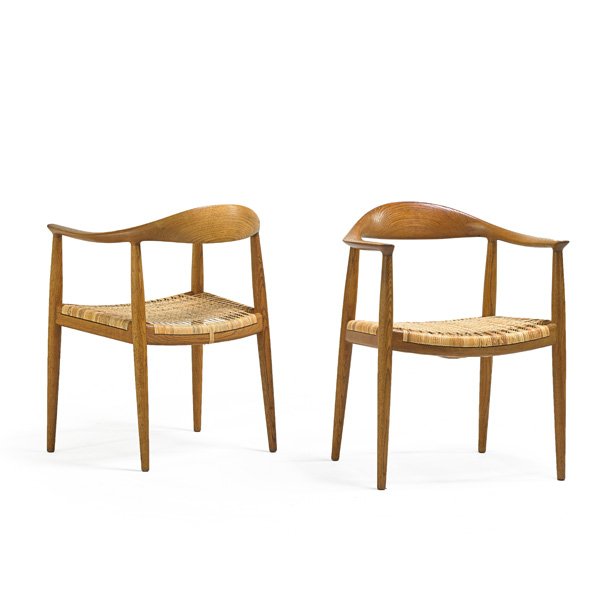 HANS WEGNER; JOHANNES HANSEN Pr. The Chair: HANS WEGNER (1914 - 2007) JOHANNES HANSEN Pair of The Chair, Denmark, 1960s; Oak, woven cane; Branded; 30" x 25" x 21" Provenance: Original owner